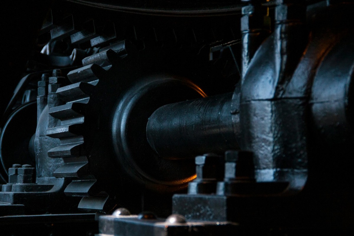 Close view of a gear and shaft on heavy machinery
